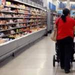 Scott Olson/Getty Images/FILE | Customers shop at a Walmart store on May 18, 2023, in Chicago, Illinois.